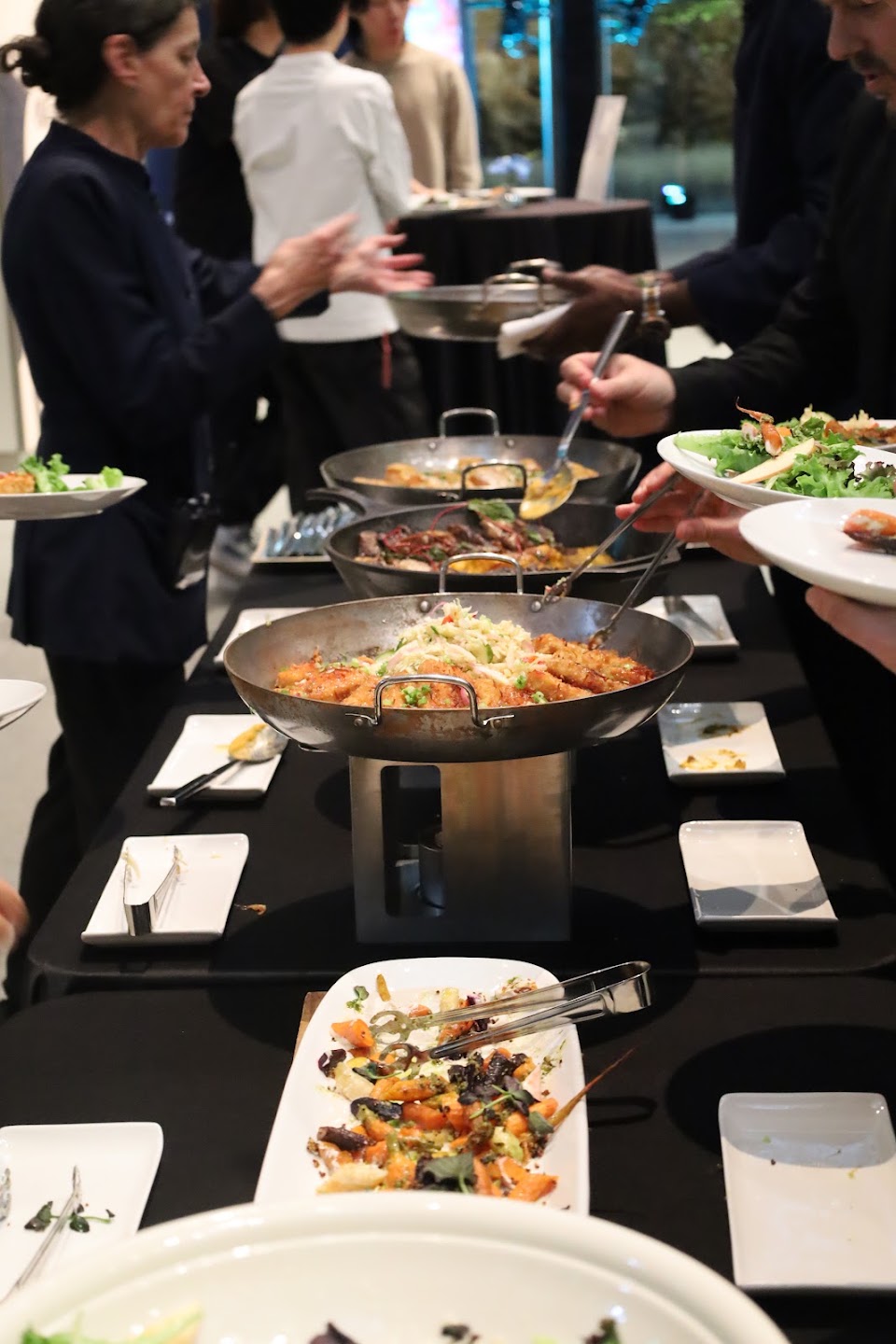 Guests gathering around the food service during the AMIF gala