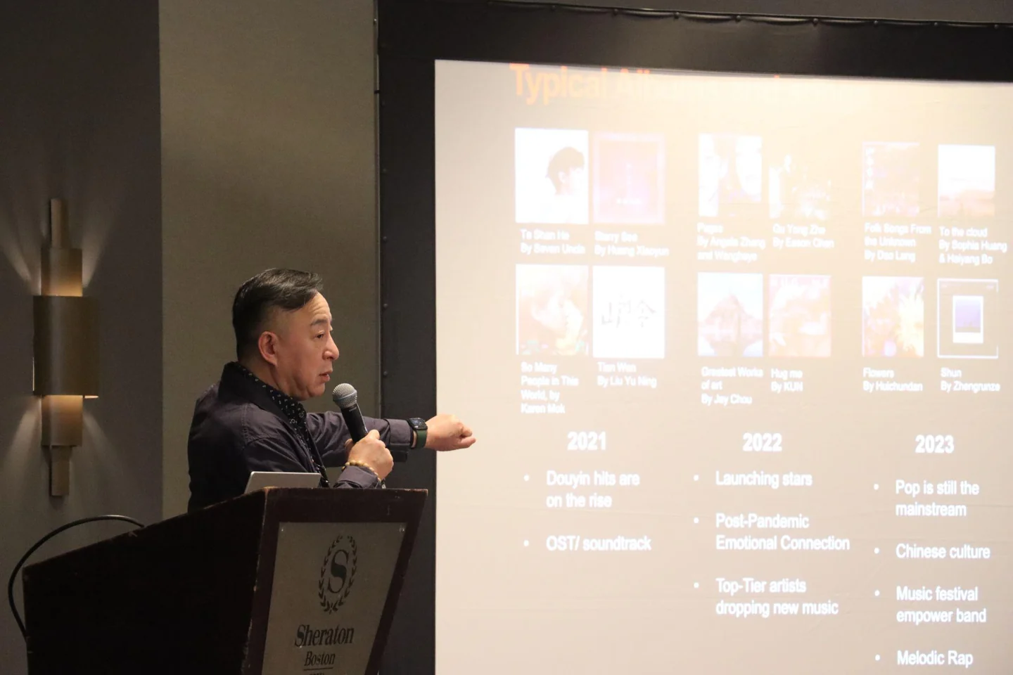 A speaker presents music-industry research at AMIF 2025