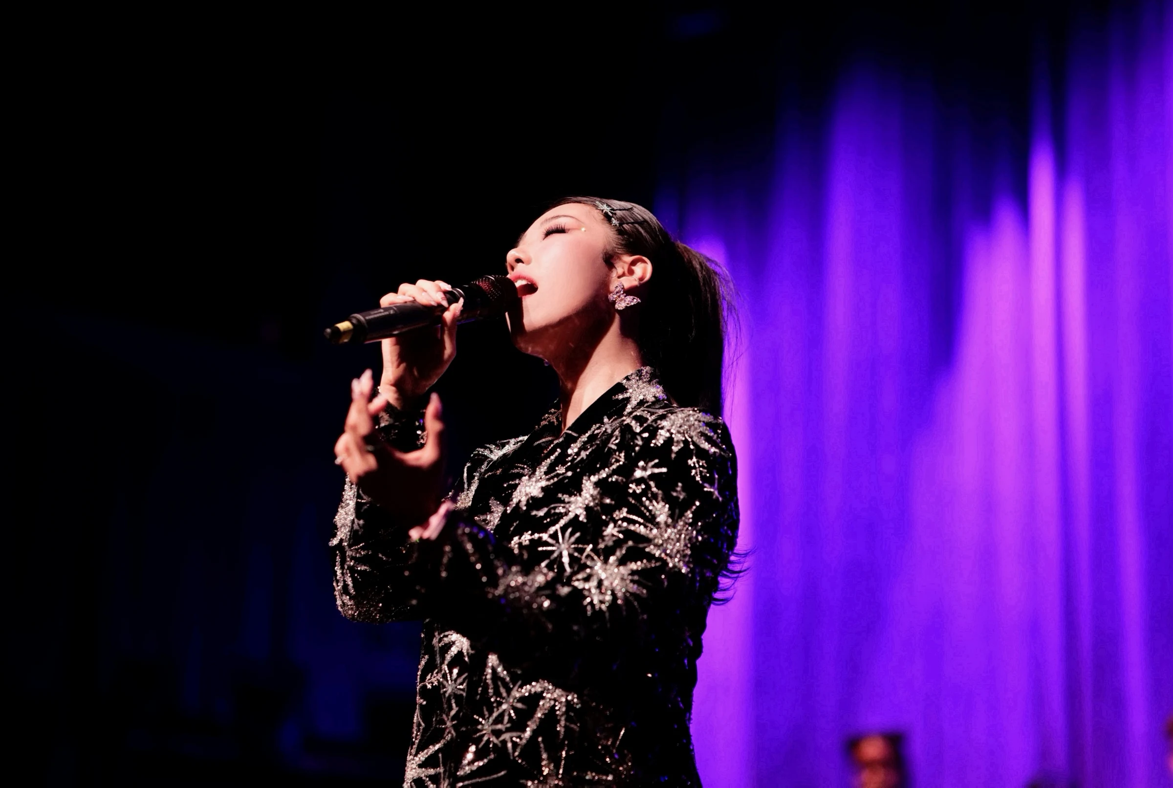 AMIF singer performing on stage